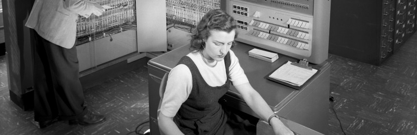 Man and woman working with IBM type 704 electronic data processing machine used for making computations for aeronautical research 1957 public domain